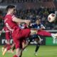 Liverpool's Dominik Szoboszlai reaches for the ball during the Europa League quarterfinal, second leg, soccer match between Atalanta and Liverpool at the Stadio di Bergamo, in Bergamo, Italy, Thursday, April 18, 2024. (AP Photo/Antonio Calanni)