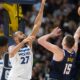Denver Nuggets center Nikola Jokic, right, shoots against Minnesota Timberwolves center Rudy Gobert in the second half of an NBA basketball game Wednesday, April 10, 2024, in Denver. (AP Photo/David Zalubowski)