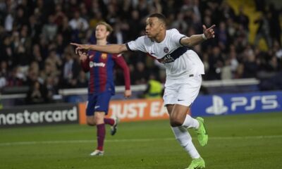 PSG's Kylian Mbappe celebrates after scoring his side's third goal during the Champions League quarterfinal second leg soccer match between Barcelona and Paris Saint-Germain at the Olimpic Lluis Companys stadium in Barcelona, Spain, Tuesday, April 16, 2024. (AP Photo/Emilio Morenatti)