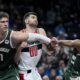 Milwaukee Bucks center Brook Lopez (11) and guard Malik Beasley (5) battle for the rebound position with Washington Wizards forward Tristan Vukcevic (00) during the first half of an NBA basketball game Tuesday, April 2, 2024, in Washington. (AP Photo/Alex Brandon)