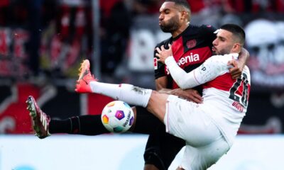 Leverkusen's Jonathan Tah, left, and Stuttgart's Deniz Undav, right, challenge for the ball during German Bundesliga soccer match between Bayer 04 Leverkusen and VfB Stuttgart in Leverkusen, Germany, Saturday, April 27, 2024. (Marius Becker/dpa via AP)
