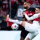 Leverkusen's Jonathan Tah, left, and Stuttgart's Deniz Undav, right, challenge for the ball during German Bundesliga soccer match between Bayer 04 Leverkusen and VfB Stuttgart in Leverkusen, Germany, Saturday, April 27, 2024. (Marius Becker/dpa via AP)