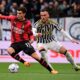 AC Milan's Christian Pulisic, left, and Juventus' Filip Kostic vie for the ball during a Serie A soccer match between Juventus and Milan at the Allianz Stadium in Turin, Italy, Saturday, April 27, 2024. (Marco Alpozzi/LaPresse via AP)
