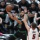 Boston Celtics forward Jayson Tatum (0) goes up for a shot against Miami Heat forward Nikola Jovic (5) during the first half of Game 3 of an NBA basketball first-round playoff series, Saturday, April 27, 2024, in Miami. (AP Photo/Wilfredo Lee)