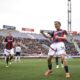 Bologna's Alexis Saelemaekers celebrates after scoring the 2-0 goal during the Italian Serie A soccer match between Bologna and Salernitana at the Renato Dall'Ara Stadium in Bologna, Italy, Monday, April 1, 2024. (Massimo Paolone/LaPresse via AP)