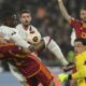 Roma's Edoardo Bove, left, AC Milan's Fikayo Tomori, Roma's goalkeeper Mile Svilar battle for the ball during the Europa League quarterfinal second leg soccer match between Roma and AC Milan at Rome's Olympic Stadium, Thursday, April 18, 2024. (Alfredo Falcone/LaPresse via AP)