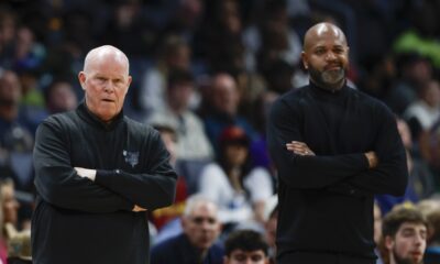 Charlotte Hornets head coach Steve Clifford, left, and Cleveland Cavaliers head coach J.B. Bickerstaff watch as their teams play during the first half of an NBA basketball game in Charlotte, N.C., Wednesday, March 27, 2024. (AP Photo/Nell Redmond)