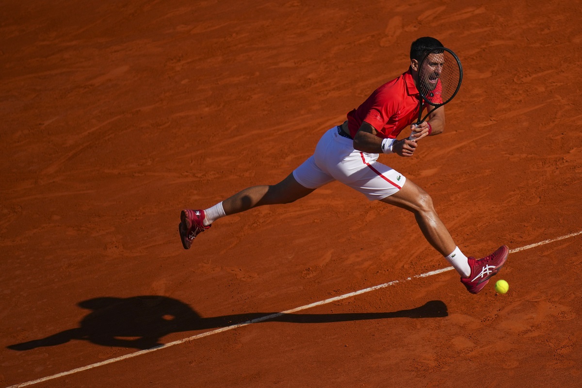 Serbia's Novak Djokovic returns the ball to Casper Ruud, of Norway, during their Monte Carlo Tennis Masters semifinal match in Monaco, Saturday, April 13, 2024. (AP Photo/Daniel Cole)