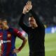 Barcelona's head coach Xavi Hernandez, right, and Barcelona's Raphinha salute supporters at the end of the Champions League quarterfinal second leg soccer match between Barcelona and Paris Saint-Germain at the Olimpic Lluis Companys stadium in Barcelona, Spain, Tuesday, April 16, 2024. (AP Photo/Joan Monfort)