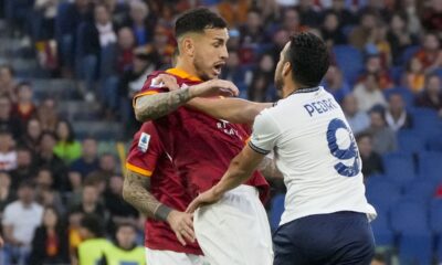 Lazio's Pedro, right, argues with Roma's Leandro Paredes during a Serie A soccer match between Roma and Lazio, at Stadio Olimpico, in Rome, Italy, Saturday, April 6, 2024. (AP Photo/Gregorio Borgia)