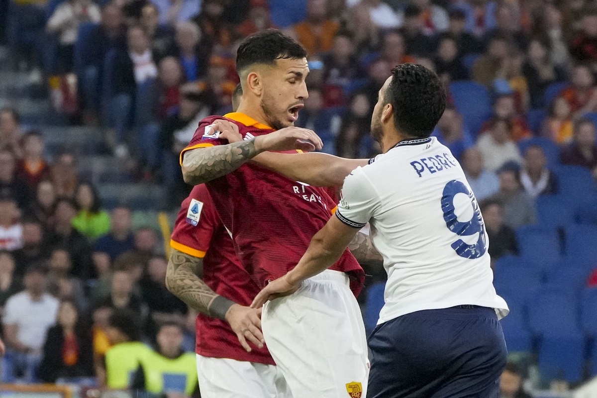Lazio's Pedro, right, argues with Roma's Leandro Paredes during a Serie A soccer match between Roma and Lazio, at Stadio Olimpico, in Rome, Italy, Saturday, April 6, 2024. (AP Photo/Gregorio Borgia)
