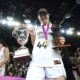 London Lions' Karlie Samuelson holds the winner's trophy and MVP trophy following the second leg of the EuroCup women's basketball final against Besiktas, Wednesday, April 10, 2024, at the Copperbox Arena in London. (Zac Goodwin/PA via AP)