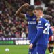 Chelsea's Noni Madueke celebrates with Chelsea's Cole Palmer after scoring his side's second goal during the English Premier League soccer match between Sheffield United and Chelsea at Bramall Lane stadium in Sheffield, England, Sunday, April 7, 2024. (AP Photo/Rui Vieira)
