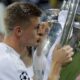 Real Madrid's Toni Kros celebrates with the trophy after the Champions League final soccer match between Real Madrid and Atletico Madrid at the San Siro stadium in Milan, Italy, on May 28, 2016. Real Madrid said the 34-year-old German international “has decided to bring an end to his time as a professional footballer following Euro 2024.” (AP Photo/Manu Fernandez)