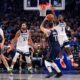 Dallas Mavericks guard Luka Doncic (77) shoots against Minnesota Timberwolves guard Anthony Edwards (5) during the first half in Game 4 of the NBA basketball Western Conference finals, Tuesday, May 28, 2024, in Dallas. (AP Photo/Julio Cortez)