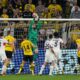 PSG's goalkeeper Gianluigi Donnarumma, top, catches the ball during the Champions League semifinal first leg soccer match between Borussia Dortmund and Paris Saint-Germain at the Signal-Iduna Park in Dortmund, Germany, Wednesday, May 1, 2024. (AP Photo/Martin Meissner)