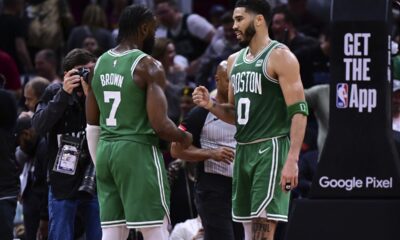 Boston Celtics forward Jayson Tatum (0) congratulates guard Jaylen Brown (7) after they defeated the Cleveland Cavaliers in Game 4 of an NBA basketball second-round playoff series, Monday, May 13, 2024, in Cleveland. (AP Photo/David Dermer)