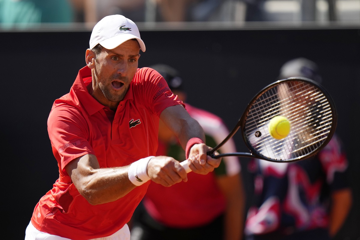 Serbia's Novak Djokovic returns the ball to Chile's Alejandro Tabilo at the Italian Open tennis tournament in Rome, Sunday, May 12, 2024. (AP Photo/Alessandra Tarantino)