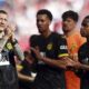 From left, Dortmund's players Marco Reus, Felix Nmecha, Gregor Kobel and Youssoufa Moukoko applaud after the German Bundesliga soccer match between RB Leipzig and Borussia Dortmund in Leipzig, Germany, Saturday, April 27, 2024. (Jan Woitas/dpa via AP)