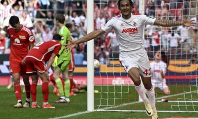 Cologne's Damion Downs celebrates after scoring his side's third goal during German Bundesliga soccer match between 1. FC Cologne and 1. FC Union Berlin in Cologne, Germany, Saturday, May 11, 2024. (Federico Gambarini/dpa via AP)