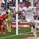 Cologne's Damion Downs celebrates after scoring his side's third goal during German Bundesliga soccer match between 1. FC Cologne and 1. FC Union Berlin in Cologne, Germany, Saturday, May 11, 2024. (Federico Gambarini/dpa via AP)