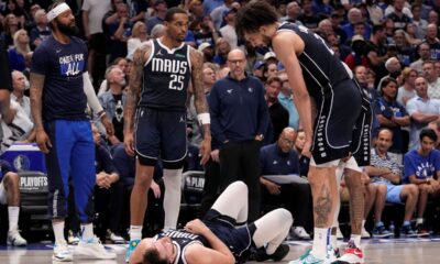 Dallas Mavericks' Markieff Morris, left, P.J. Washington (25), head coach Jason Kidd, center rear, and Dereck Lively II, right, look toward Luka Doncic, bottom, after Doncic and Oklahoma City Thunder' Luguentz Dort collided competing for a loose ball during the second half in Game 3 of an NBA basketball second-round playoff series, Saturday, May 11, 2024, in Dallas. (AP Photo/Tony Gutierrez)