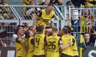 Dortmund's Marcus Reus, top, celebrates after scoring their side's second goal of the game during the Bundesliga soccer match between Borussia Dortmund and SV Darmstadt 98 at the Signal Iduna Park in Dortmund, Germany, Saturday May 18, 2024. (Bernd Thissen/dpa via AP)