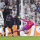 Real Madrid's Joselu, left, scores his side's opening goal in front of Bayern's goalkeeper Manuel Neuer, right, during the Champions League semifinal second leg soccer match between Real Madrid and Bayern Munich at the Santiago Bernabeu stadium in Madrid, Spain, Wednesday, May 8, 2024. (AP Photo/Manu Fernandez)