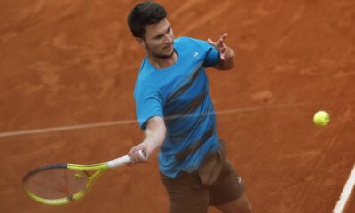 Serbia's Miomir Kecmanovic plays a shot against Russia's Daniil Medvedev during their second round match of the French Open tennis tournament at the Roland Garros stadium in Paris, Thursday, May 30, 2024. (AP Photo/Aurelien Morissard)