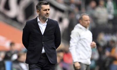 Berlin's head coach Nenad Bjelica, front, follows the German Bundesliga soccer match between Borussia Moenchengladbach and 1. FC Union Berlin in Moenchengladbach, Germany, Sunday, April 28, 2024. (Federico Gambarini/dpa via AP)