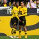 Dortmund's Youssoufa Moukoko, leftt, celebrates with his teammate Watjen Kjell-Arik after he scored his side's first goal during the German Bundesliga soccer match between Borussia Dortmund and Augsburg, in Dortmund, Saturday, May 4, 2024. (AP Photo/Martin Meissner)