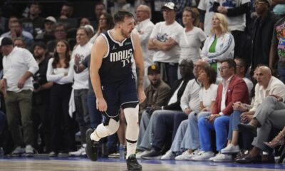 Dallas Mavericks guard Luka Doncic (77) celebrates a score against the Minnesota Timberwolves during the second half in Game 1 of the NBA basketball Western Conference finals, Wednesday, May 22, 2024, in Minneapolis. (AP Photo/Abbie Parr)