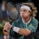 Andrey Rublev, of Russia, returns the ball to Carlos Alcaraz, of Spain, during the Mutua Madrid Open tennis tournament in Madrid, Wednesday, May 1, 2024. (AP Photo/Manu Fernandez)