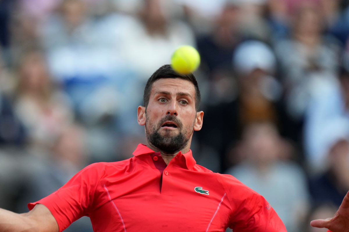 Serbia's Novak Djokovic returns the ball to France's Corentin Moutet at the Italian Open tennis tournament in Rome, Friday, May 10, 2024. (AP Photo/Alessandra Tarantino)