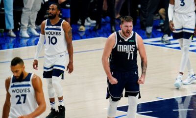 Dallas Mavericks guard Luka Doncic (77) celebrates a play against the Minnesota Timberwolves during the second half in Game 3 of the NBA basketball Western Conference finals, Sunday, May 26, 2024, in Dallas. (AP Photo/Gareth Patterson)