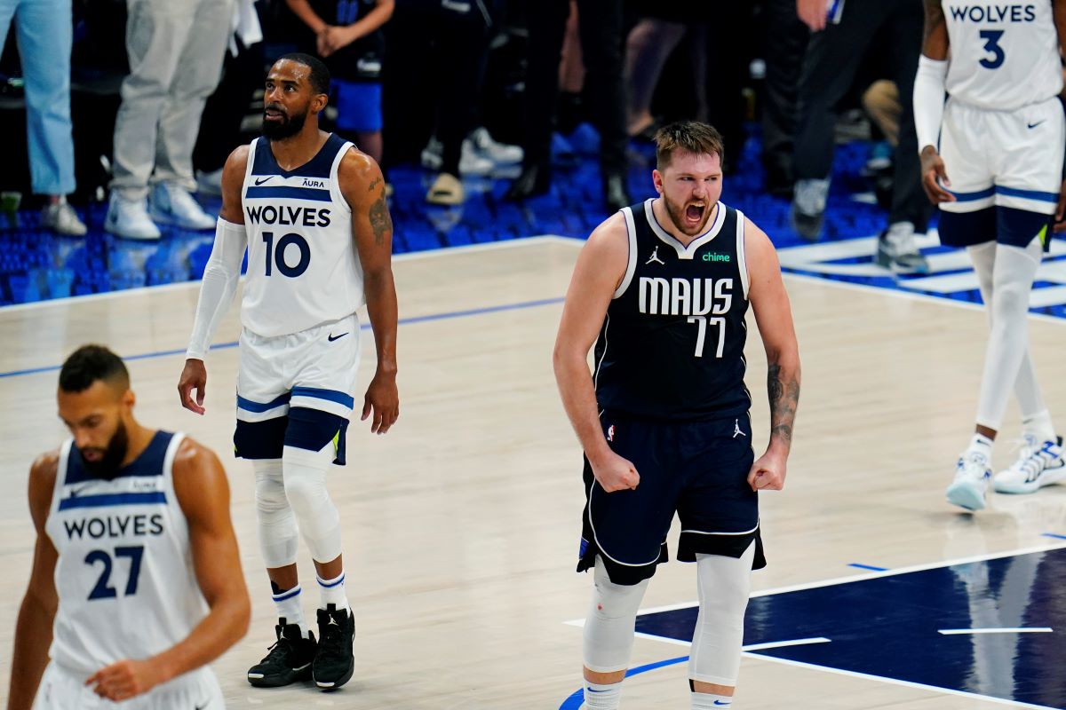 Dallas Mavericks guard Luka Doncic (77) celebrates a play against the Minnesota Timberwolves during the second half in Game 3 of the NBA basketball Western Conference finals, Sunday, May 26, 2024, in Dallas. (AP Photo/Gareth Patterson)