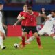 Austria's Marko Arnautovic, centre, challenges for the ball with Serbia's Nemanja Gudelj during an international friendly soccer match between Austria and Serbia at the Ernst Happel Stadion in Vienna, Austria, Tuesday, June 4, 2024. (AP Photo/Matthias Schrader)