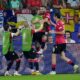 Georgia's Georges Mikautadze celebrates with his teammates after scoring his side's second goal during a Group F match between Georgia and Portugal at the Euro 2024 soccer tournament in Gelsenkirchen, Germany, Wednesday, June 26, 2024. (AP Photo/Alessandra Tarantino)