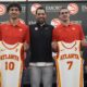 Atlanta Hawks' Zaccharie Risacher, left, General Manager Landry Fields, center, and Atlanta Hawks' Nikola Djurišić hold up their jerseys after an NBA basketball news conference, Friday, June 28, 2024, in Atlanta. Risacher was selected as the first overall pick by the Atlanta Hawks in the first round of the NBA basketball draft. (AP Photo/Brynn Anderson)