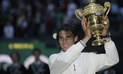 FILE - Spain's Rafael Nadal holds his trophy as he celebrates his defeat of Switzerland's Roger Federer in the men's singles final at Wimbledon, Sunday, July 6, 2008. Nadal is going to skip Wimbledon, as expected, and instead prepare for the Paris Olympics by entering a clay-court tournament in Bastad, Sweden. The 22-time Grand Slam champion said Thursday, June 13, 2024, he wants to just remain on clay, rather than switching over to grass for the All England Club and then needing to go back to clay.(AP Photo/Anja Niedringhaus, File)