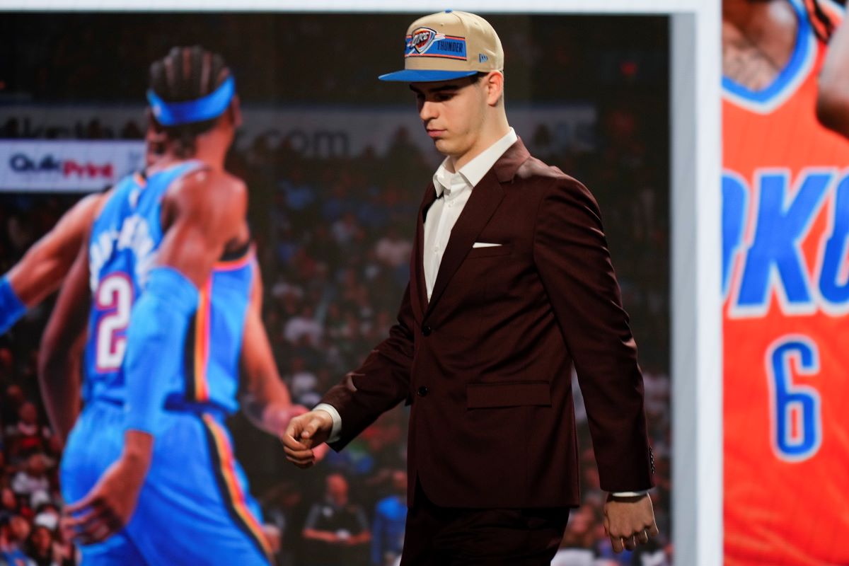 Nikola Topic walks off the stage after being selected by the Oklahoma City Thunder as the 12th pick during the first round of the NBA basketball draft, Wednesday, June 26, 2024, in New York. (AP Photo/Julia Nikhinson)