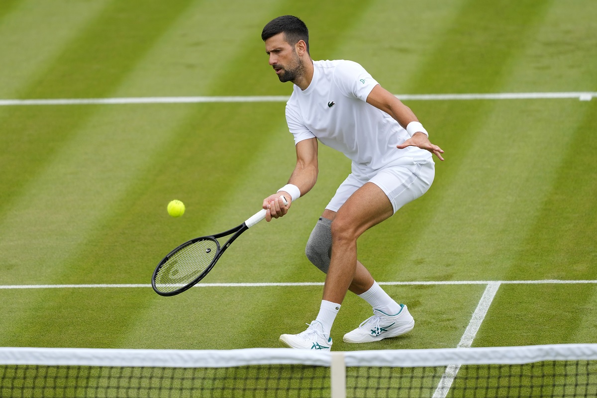 Novak Djokovic of Serbia plays a return during a training session on Court 2 at the All England Lawn Tennis and Croquet Club in Wimbledon, London, Friday, June 28, 2024. The Wimbledon Championships begin on July 1. (AP Photo/Kirsty Wigglesworth)