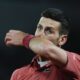 Serbia's Novak Djokovic wipes his face in his third round match of the French Open tennis tournament against Italy's Lorenzo Musetti at the Roland Garros stadium in Paris, Saturday, June 1, 2024. (AP Photo/Thibault Camus)