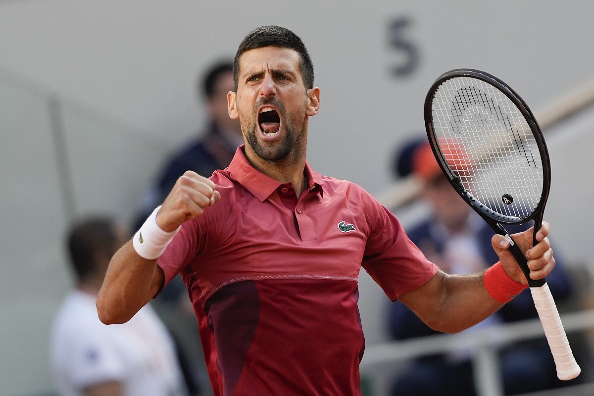 Serbia's Novak Djokovic clenches his fist after holding his service game and reaching 5-5 in the fourth set during his fourth round match of the French Open tennis tournament against Argentina's Francisco Cerundolo at the Roland Garros stadium in Paris, Monday, June 3, 2024. (AP Photo/Thibault Camus)