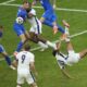 England's Jude Bellingham, right, scores his side's first goal with an overhead kick during a round of sixteen match between England and Slovakia at the Euro 2024 soccer tournament in Gelsenkirchen, Germany, Sunday, June 30, 2024. (AP Photo/Ebrahim Noroozi)