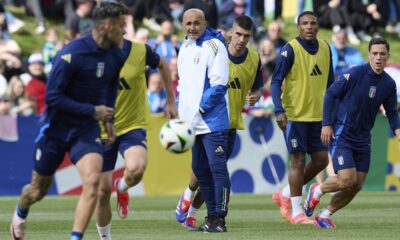 Italy's head coach Luciano Spalletti, center, follows the Italian national soccer team's public training session in Iserlohn, Germany, Tuesday, June 11, 2024. (Bernd Thissen/dpa via AP)