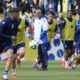 Italy's head coach Luciano Spalletti, center, follows the Italian national soccer team's public training session in Iserlohn, Germany, Tuesday, June 11, 2024. (Bernd Thissen/dpa via AP)