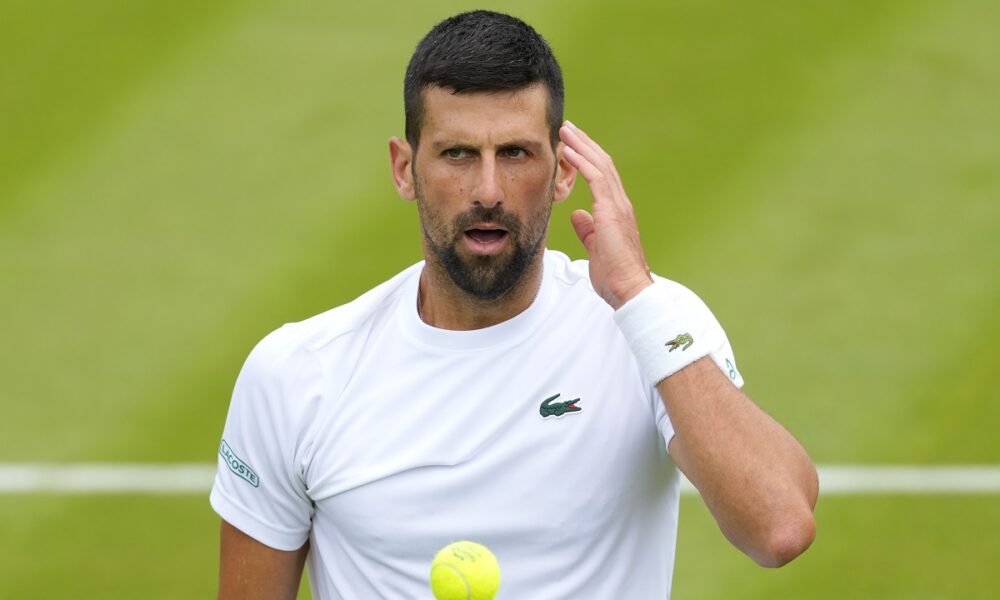 Novak Djokovic of Serbia reacts during a training session on Court 2 at the All England Lawn Tennis and Croquet Club in Wimbledon, London, Friday, June 28, 2024. The Wimbledon Championships begin on July 1. (AP Photo/Kirsty Wigglesworth)