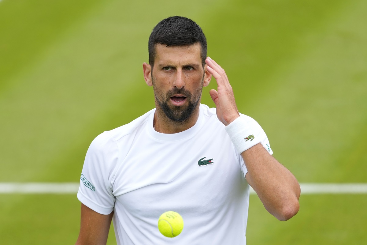 Novak Djokovic of Serbia reacts during a training session on Court 2 at the All England Lawn Tennis and Croquet Club in Wimbledon, London, Friday, June 28, 2024. The Wimbledon Championships begin on July 1. (AP Photo/Kirsty Wigglesworth)