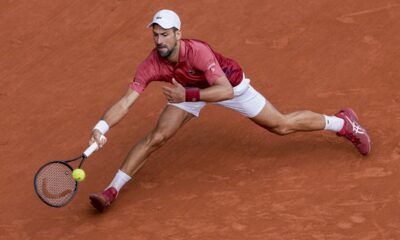 Serbia's Novak Djokovic plays a shot against Argentina's Francisco Cerundolo during their fourth round match of the French Open tennis tournament at the Roland Garros stadium in Paris, Monday, June 3, 2024. (AP Photo/Thibault Camus)